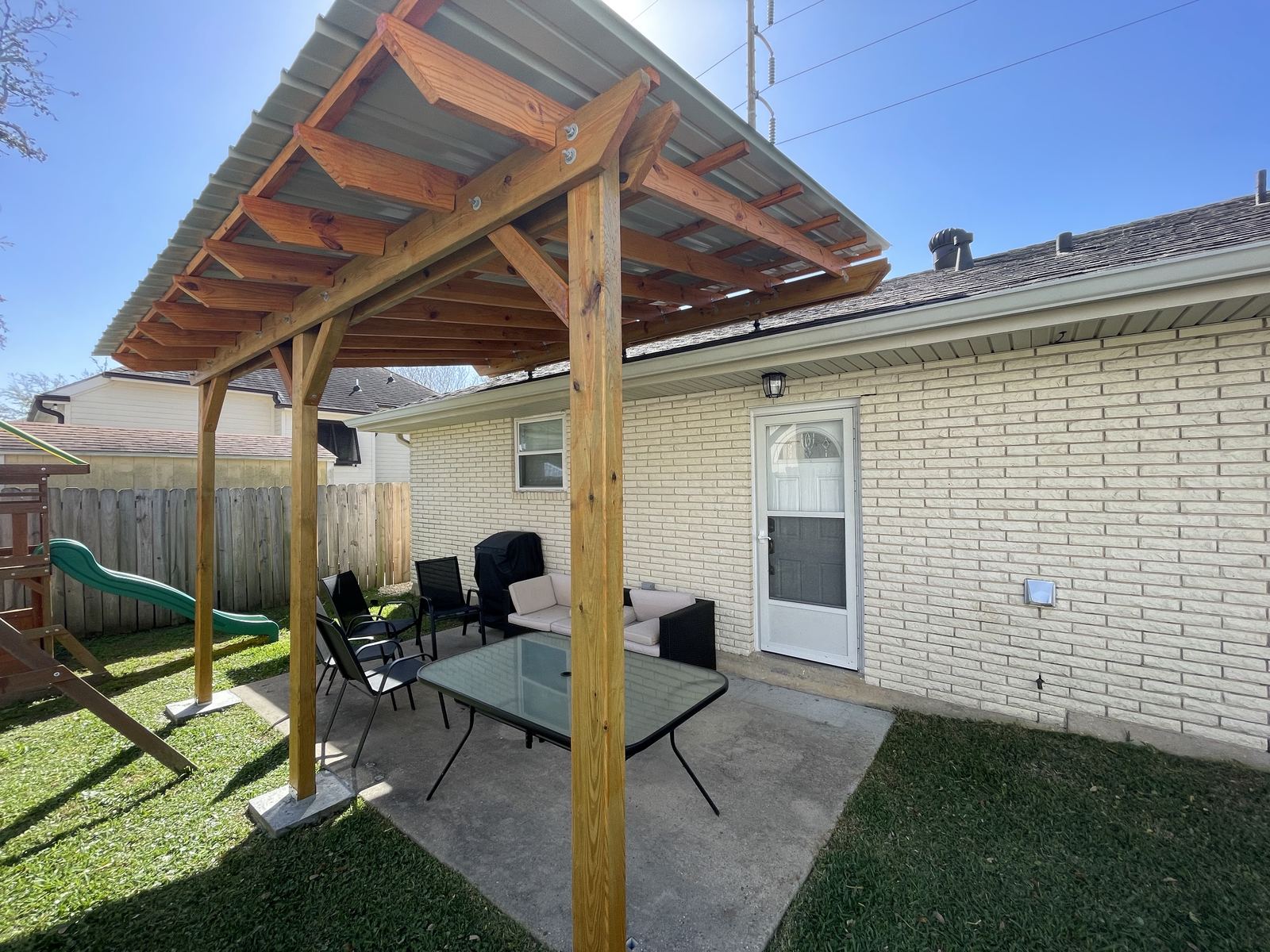 Custom-built backyard patio cover addition