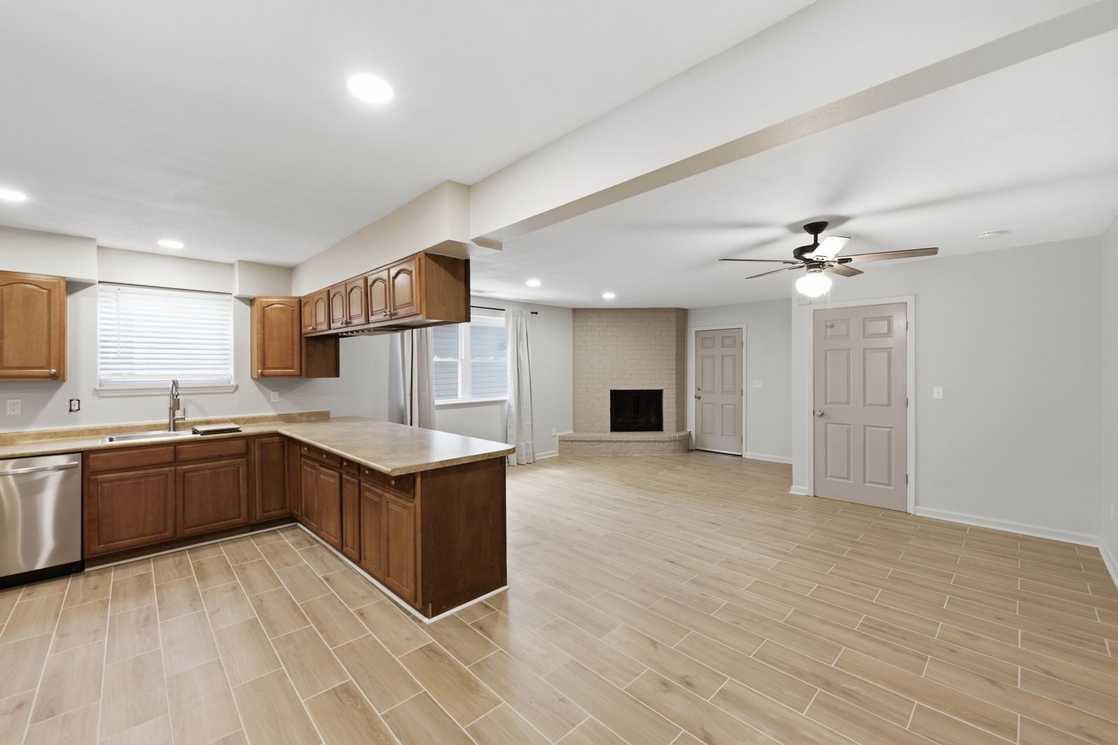 Open-concept kitchen and living area remodel with new flooring