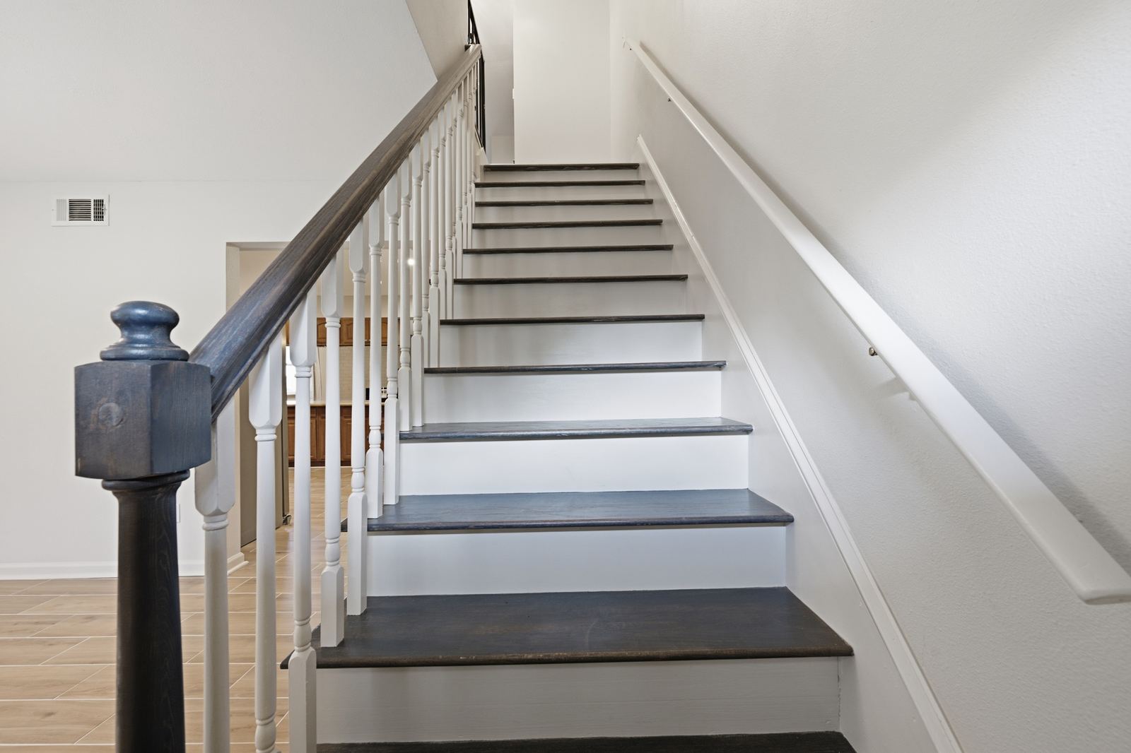 Refinished staircase with new railings and millwork